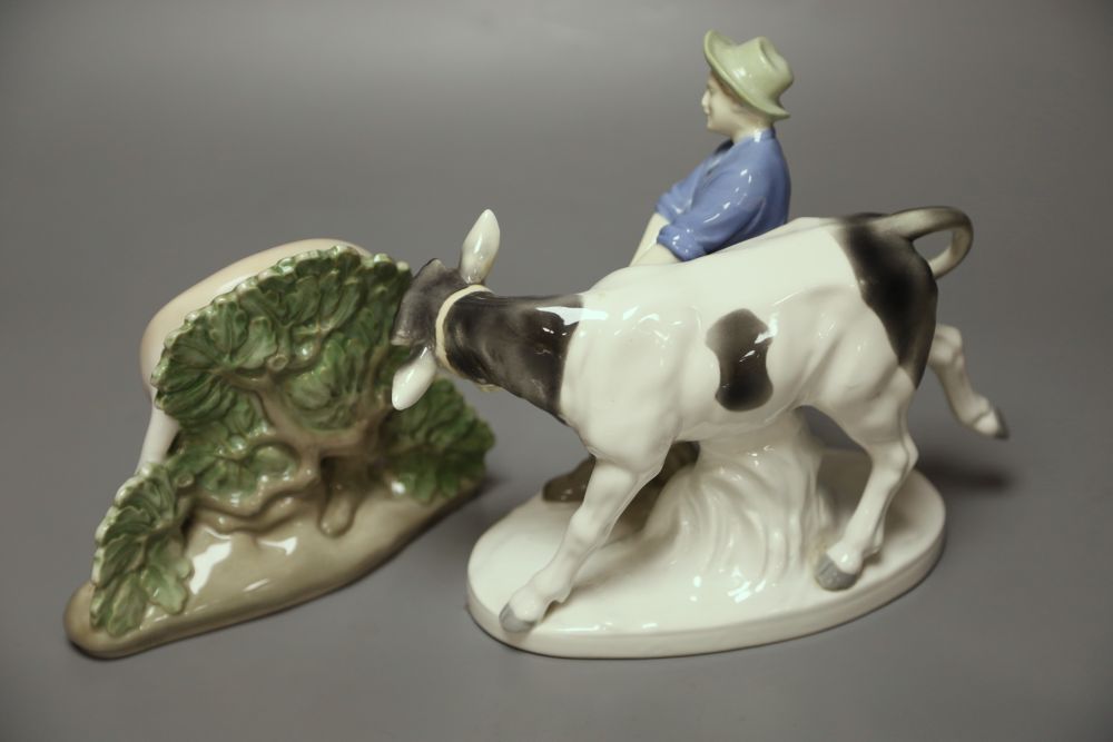 A Royal Copenhagen deer, model 2051 and a Sitzendorf figure group of a man and a cow.